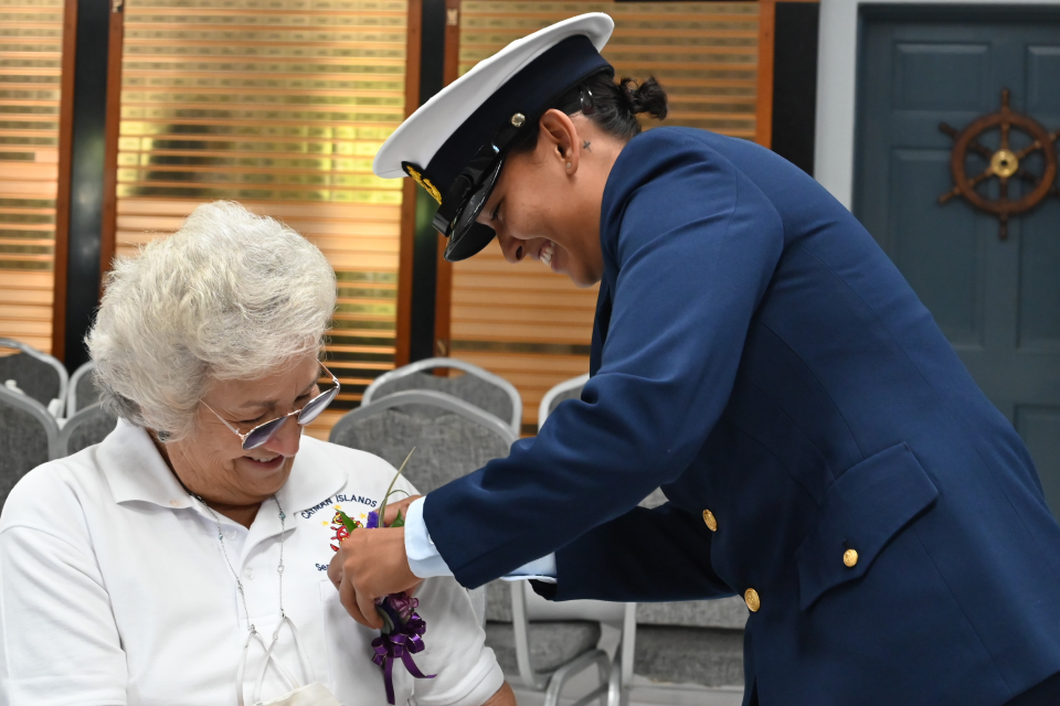 HWM Tea Party Coast Guard pinning a seafaring corsage